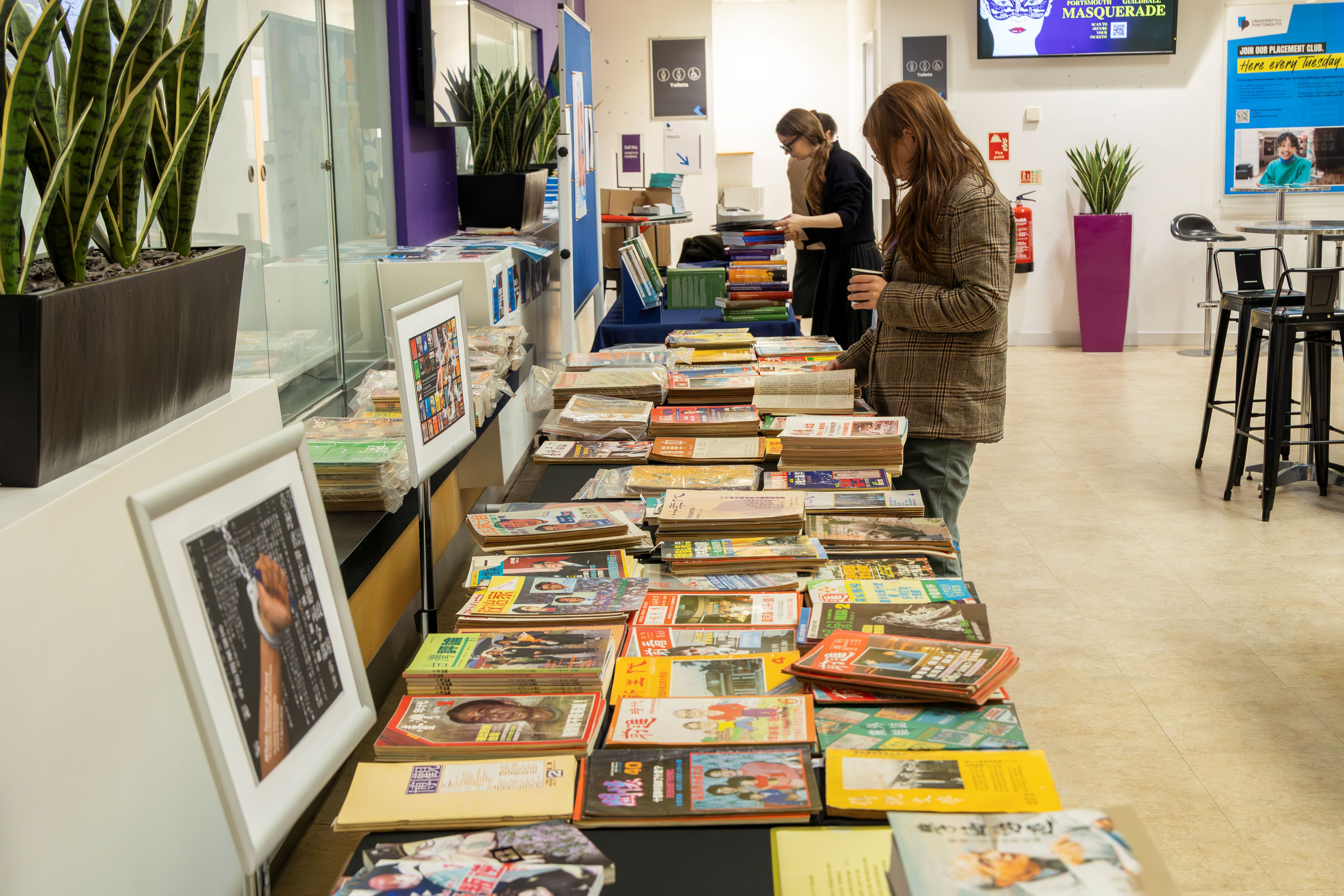 A photo of lots of magazines on a table