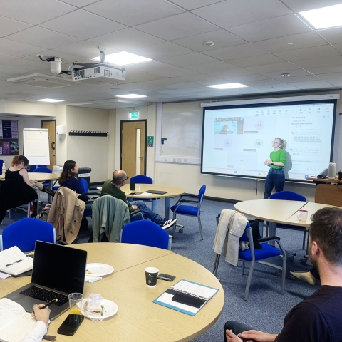 Students attending a session in a University training room