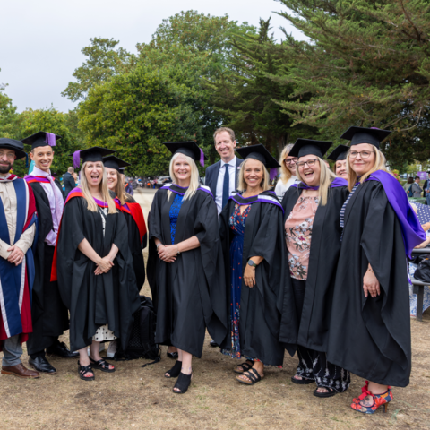 Probation Officer graduates stood outside smiling