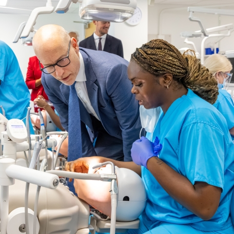 Minister of State for Care Stephen Kinnock MP with a dental hygienist student