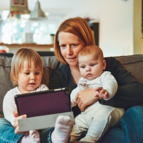 children watching TV with parent