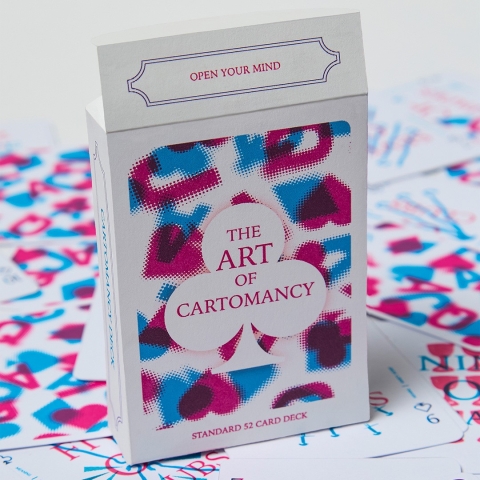 A colourful playing‑card deck titled “The Art of Cartomancy,” with a patterned box and matching cards spread beneath it.