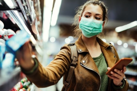 woman wearing a mask and shopping