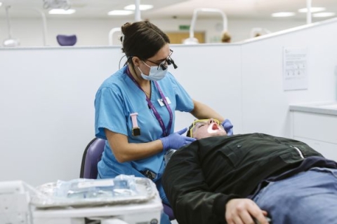 Dental student learning practical skills in Dental Clinic