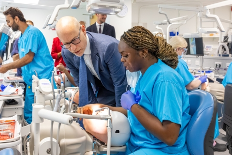 Minister of State for Care Stephen Kinnock MP with a dental hygienist student