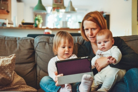 children watching TV with parent