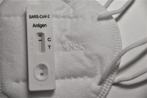 A negative covid test on top of a face mask