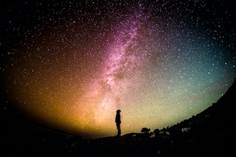 Man looking at the night sky