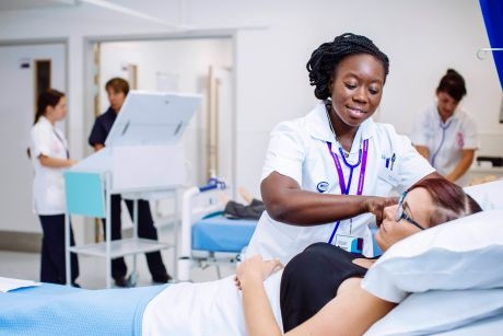 A nurse looking after a patient