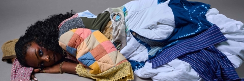 Student lying down wearing a colourful garment - 