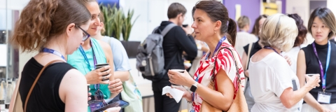 Conference delegates chatting over refreshments