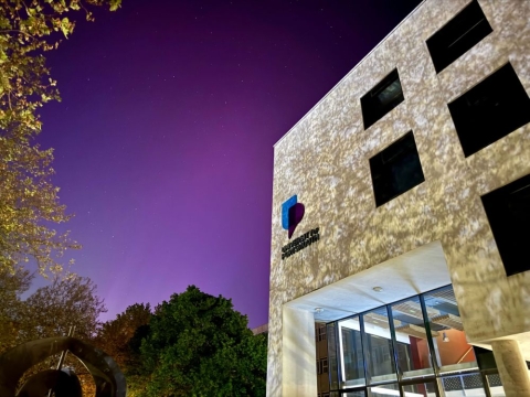 The University's Dennis Sciama building against a backdrop of the Northern Lights