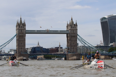 Two rowing boats in front of Tower Bridge, London