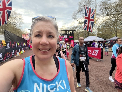 Nicola Crowson smiling taking a selfie during a marathon run