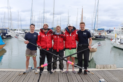 A crew of five rowers