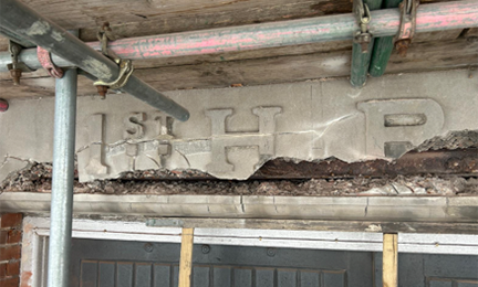 A cracked and damaged lintel 