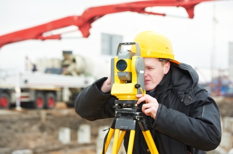 Student using surveying equipment