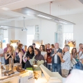group of people attending graduate show 2025