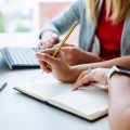 Female lawyer holding a pencil, making notes