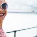 student smiling in the sun on Southsea pier