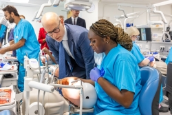 Minister of State for Care Stephen Kinnock MP with a dental hygienist student