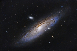 Image of outer space showing darkness, light sources and stars to depict the Universe