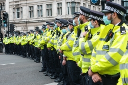 Police officers lined up - Photo by Ehimetalor Akhere Unuabona on Unsplash
