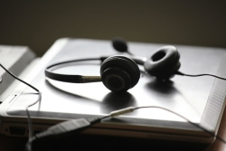 A pair of headphones on a closed laptop