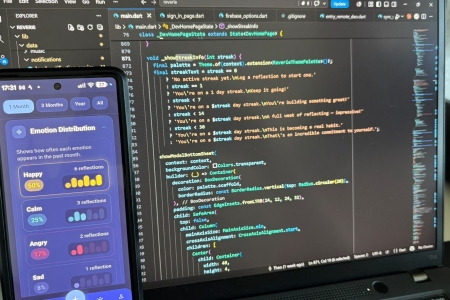 A picture of the Reverie App frontface on a phone next to the back interface on a laptop