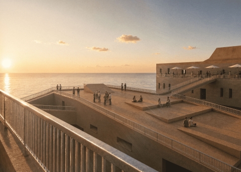 A tiered coastal building with terraces overlooking the sea at sunset, with people sitting, standing, and walking across the ramps and platforms.
