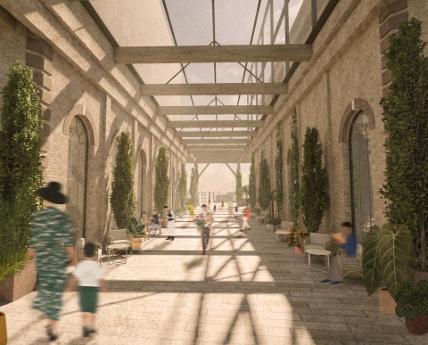 A tall, plant‑lined corridor lit from above by skylights.