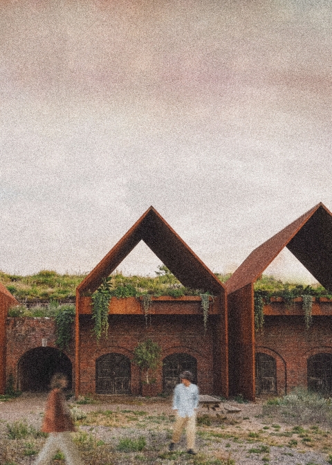 an image render of dwellings - there are two people on the grass in front and a grey sky in the back